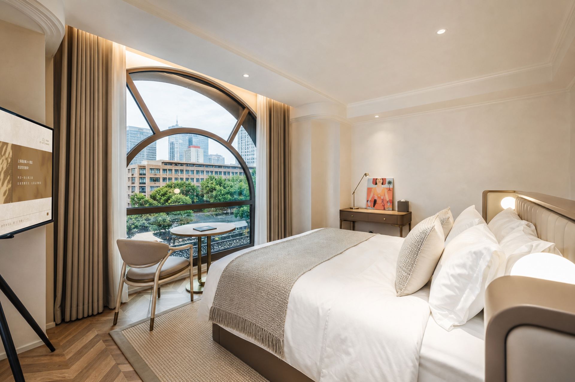 An arched window, bed and daytime street view in an H+ Executive King Room